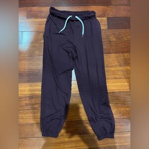Vuori Black Track Joggers with Teal Drawstring